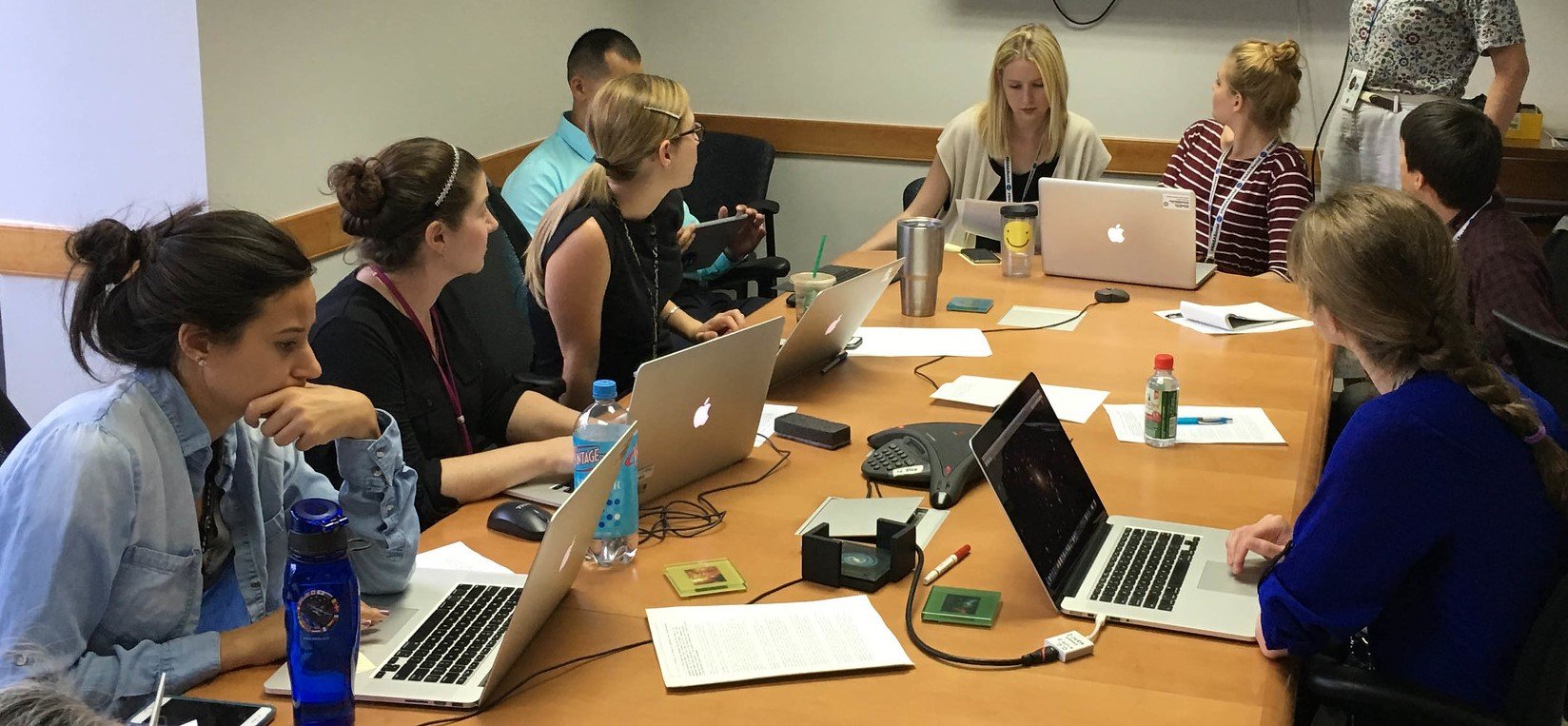 People in a meeting with laptops