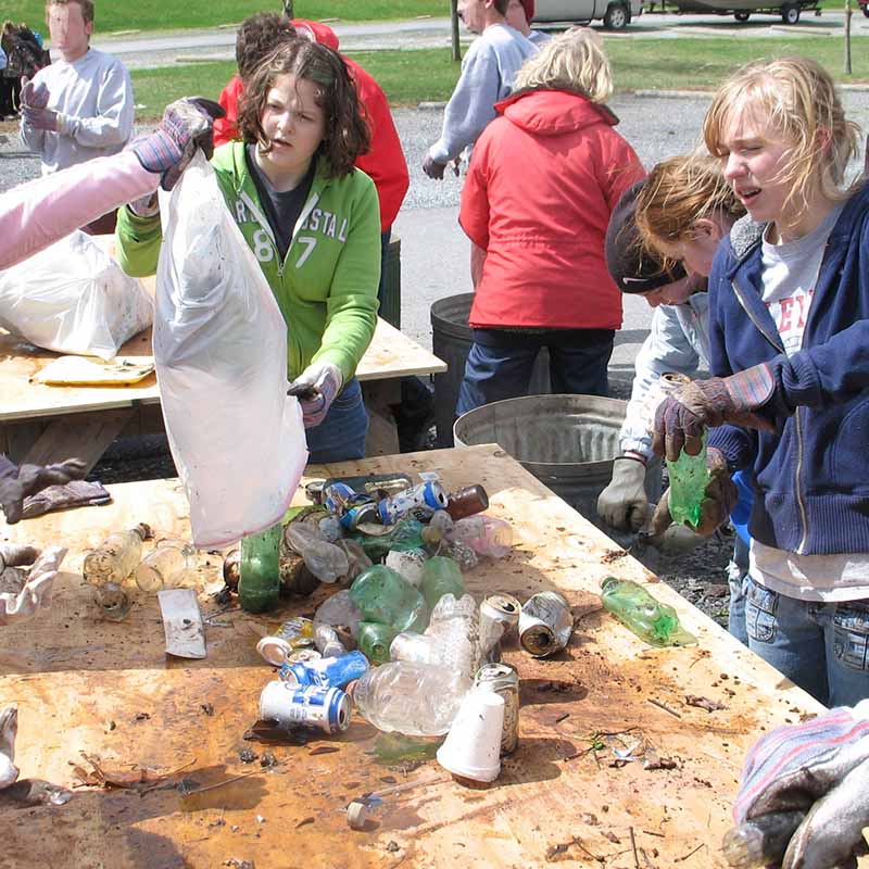 Teenagers sorting recyclables 