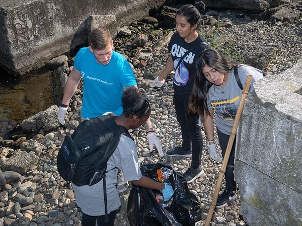 Volunteers cleaning trash from beach