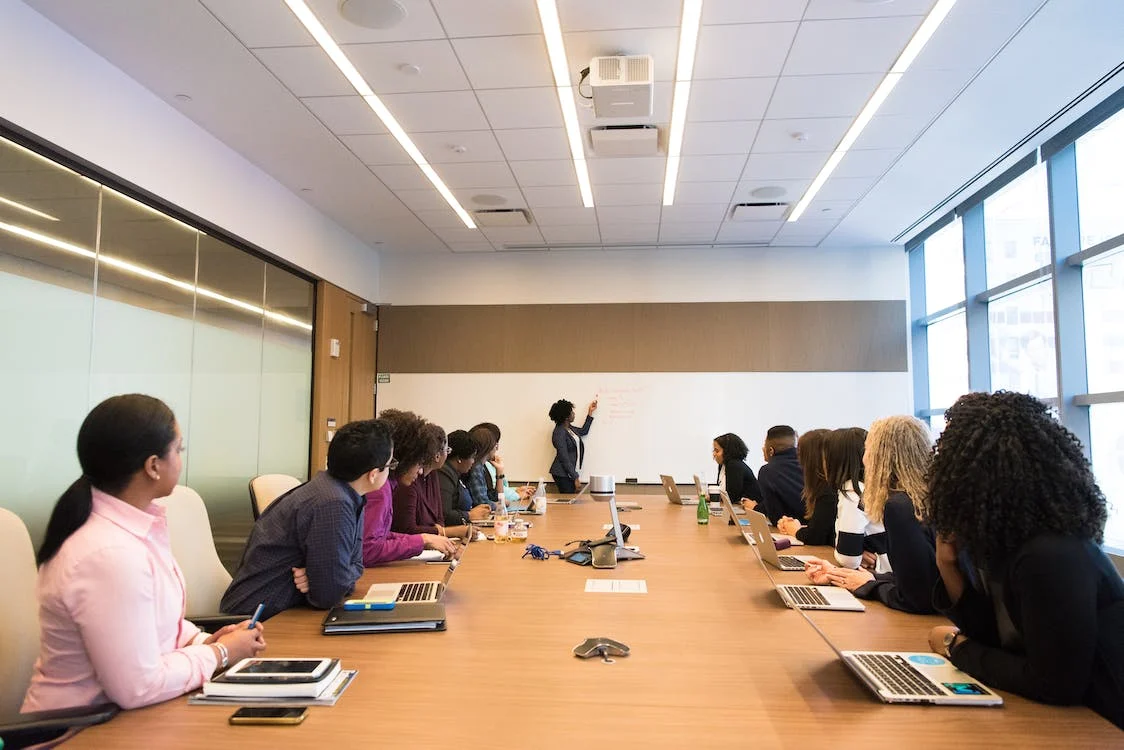 Women in conference room working on strategic planning for CSR impact measurement #WOCinTechChat